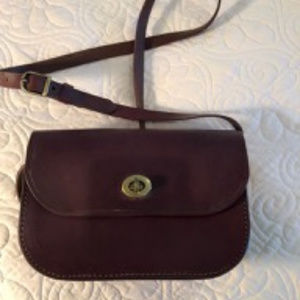 Saddle style leather cross-body bag
